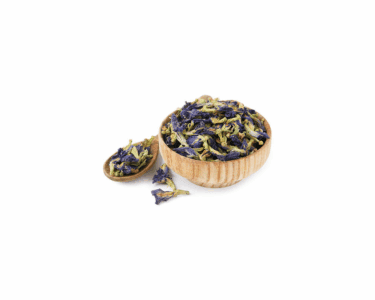 Dried blue mallow flowers in a wooden bowl and spoon